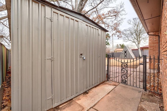 view of shed with a gate and fence