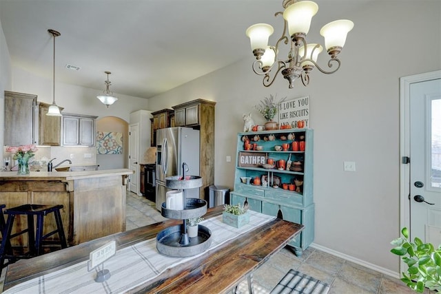 dining space featuring an inviting chandelier