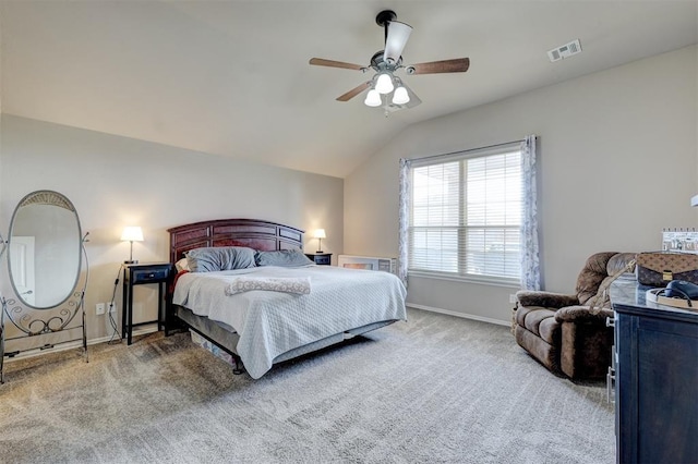 bedroom with ceiling fan, carpet floors, and lofted ceiling