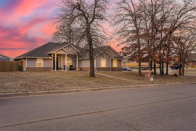 view of front of house featuring fence and board and batten siding