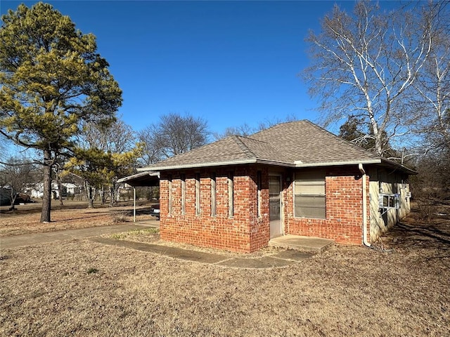 view of property exterior with a carport