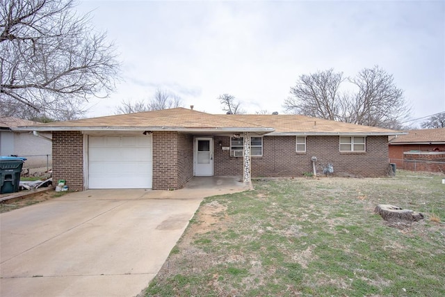 single story home featuring an attached garage, driveway, fence, and brick siding