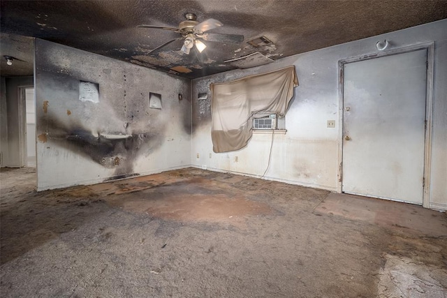 interior space featuring concrete floors, cooling unit, and a ceiling fan