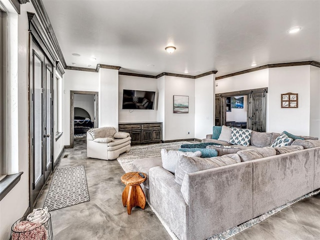 912 Ash NE, Piedmont, OK 73078 - living room featuring finished concrete flooring and recessed lighting
