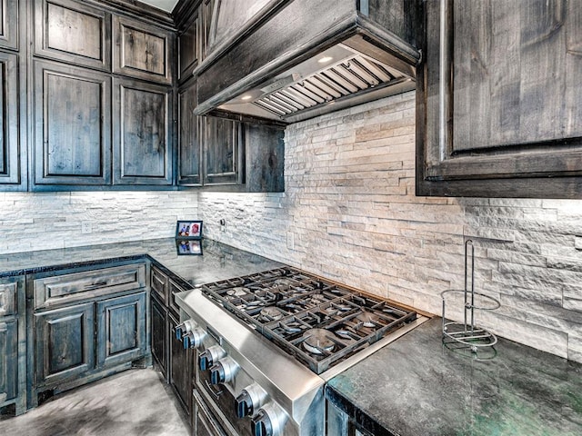 912 Ash NE, Piedmont, OK 73078 - kitchen featuring cooktop, decorative backsplash, dark countertops, stainless steel stove, and premium range hood