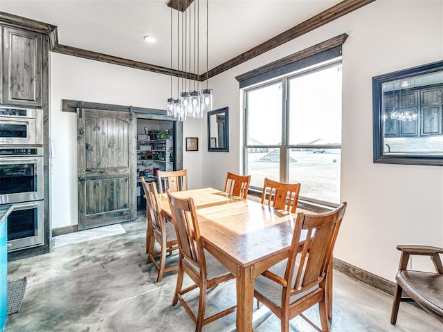 912 Ash NE, Piedmont, OK 73078 - dining room with baseboards, a barn door, ornamental molding, and concrete flooring
