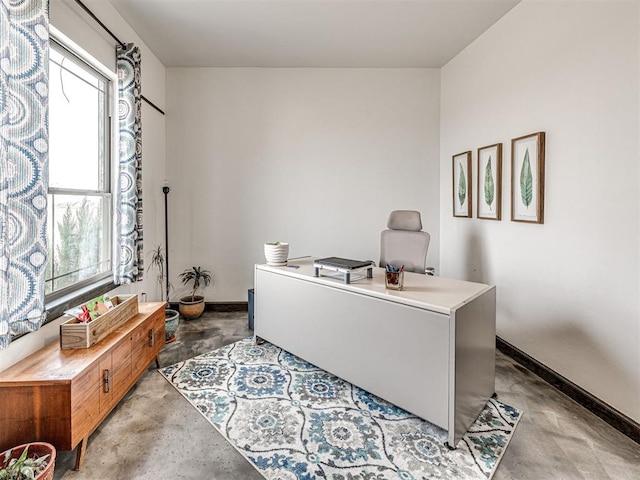 912 Ash NE, Piedmont, OK 73078 - office area featuring concrete floors and baseboards