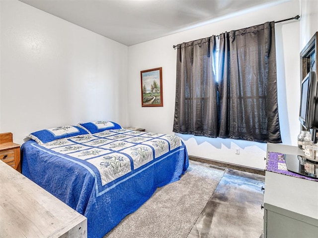 912 Ash NE, Piedmont, OK 73078 - bedroom featuring concrete floors