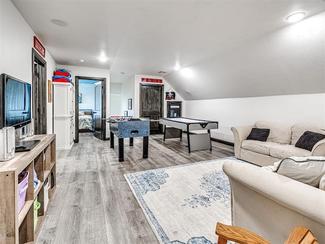 912 Ash NE, Piedmont, OK 73078 - game room with light wood-type flooring and vaulted ceiling