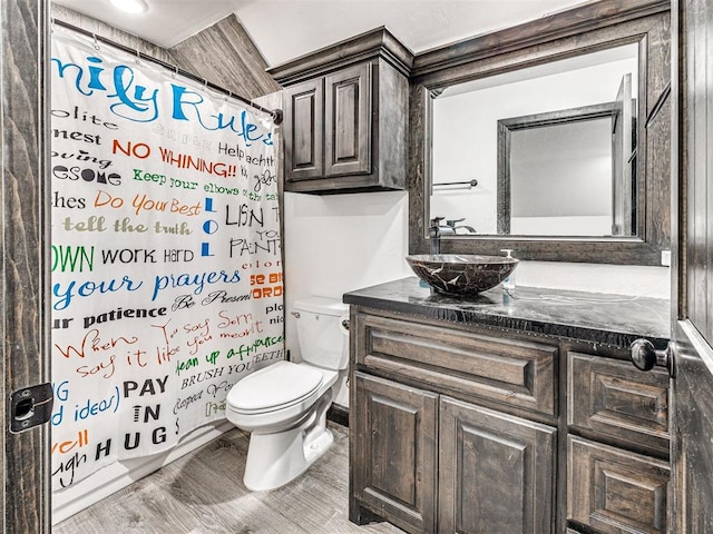 912 Ash NE, Piedmont, OK 73078 - full bathroom with toilet, wood finished floors, and vanity
