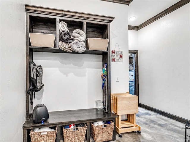 912 Ash NE, Piedmont, OK 73078 - mudroom with crown molding, baseboards, and concrete flooring