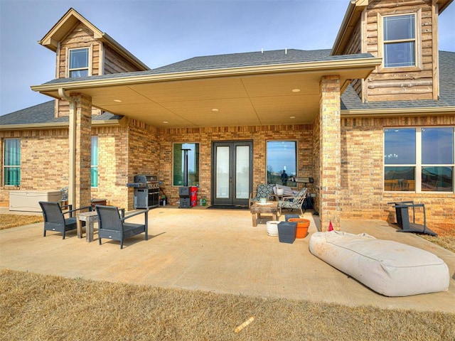 912 Ash NE, Piedmont, OK 73078 - rear view of property with french doors, a patio area, and brick siding