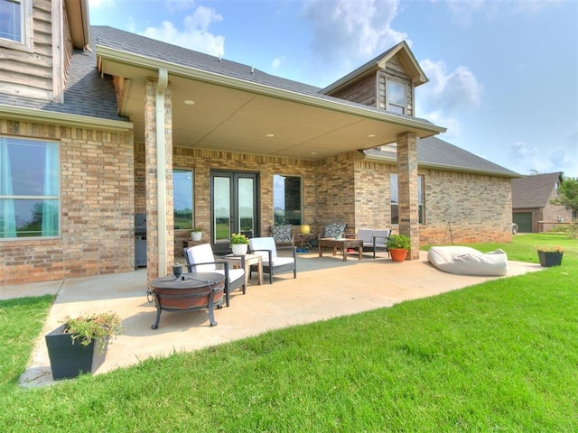912 Ash NE, Piedmont, OK 73078 - view of patio / terrace featuring an outdoor living space with a fire pit
