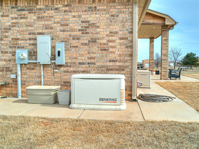 912 Ash NE, Piedmont, OK 73078 - details featuring a power unit, brick siding, and electric meter