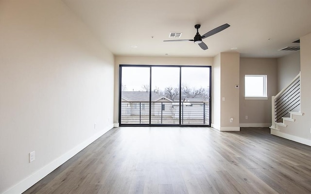 spare room featuring ceiling fan and wood-type flooring