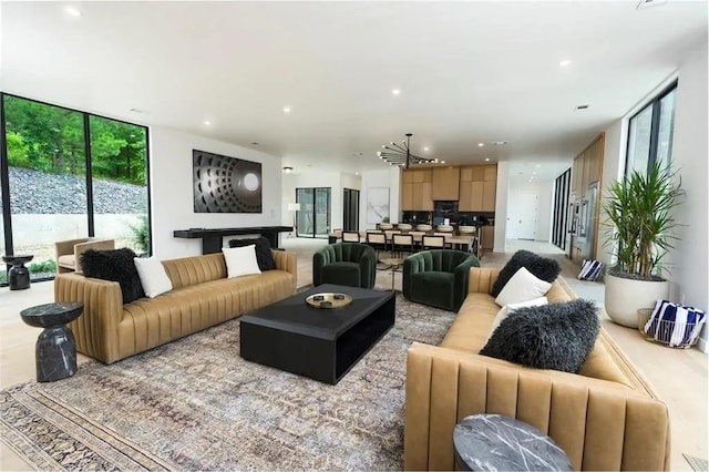 living room with floor to ceiling windows and recessed lighting