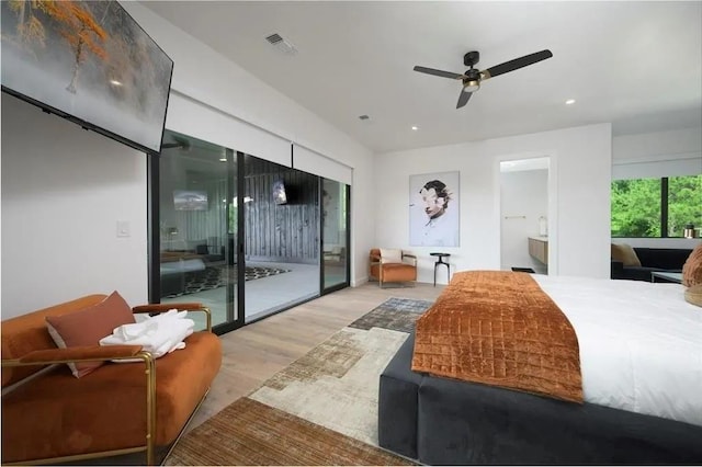 bedroom featuring access to outside, light wood-style flooring, visible vents, and recessed lighting