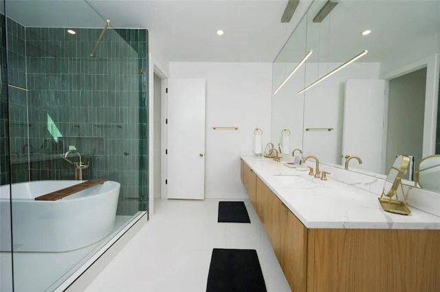 full bathroom featuring double vanity, a soaking tub, and a tile shower