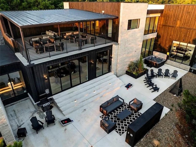 rear view of house featuring metal roof