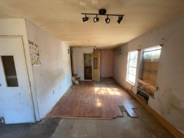 unfurnished room with wood-type flooring