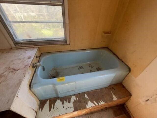 bathroom featuring a tub to relax in