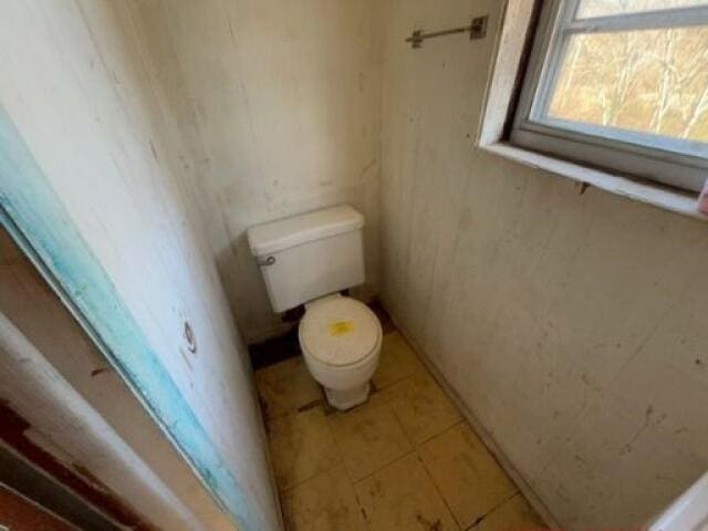 bathroom with tile patterned floors and toilet