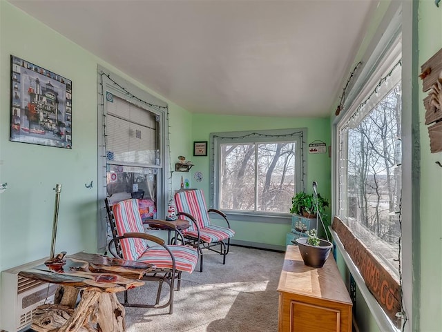 sunroom featuring vaulted ceiling