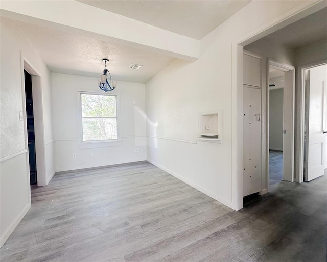 3805 SE 26th St, Del City, OK 73115 - unfurnished dining area featuring wood finished floors and a chandelier