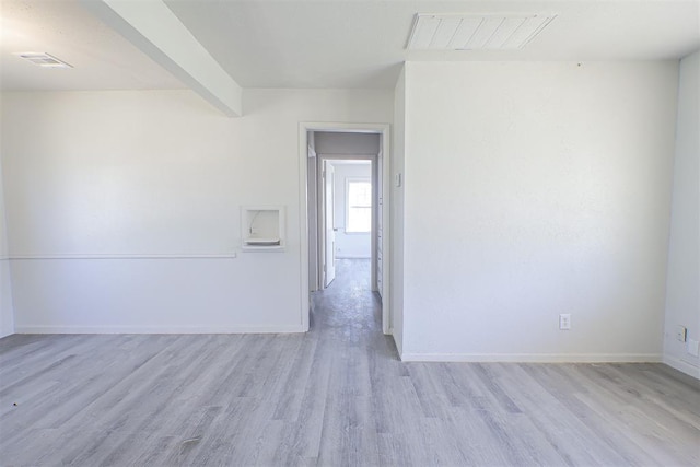 3805 SE 26th St, Del City, OK 73115 - spare room featuring light wood finished floors and beam ceiling