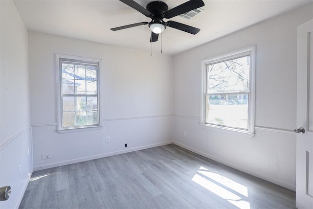3805 SE 26th St, Del City, OK 73115 - empty room with healthy amount of natural light and wood finished floors