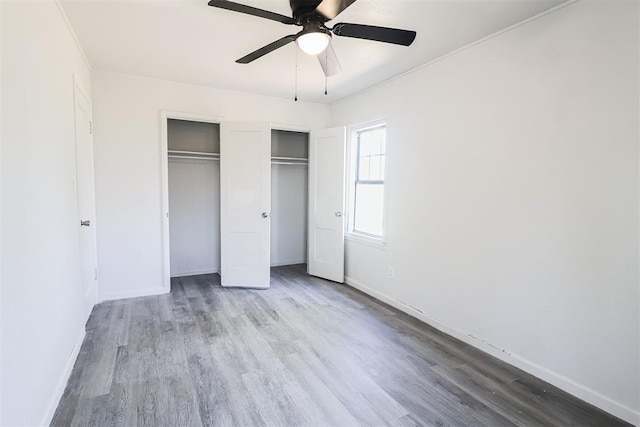 3805 SE 26th St, Del City, OK 73115 - unfurnished bedroom featuring wood finished floors and ceiling fan