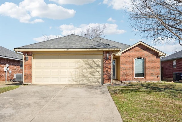 single story home featuring a front yard, brick siding, driveway, and central air condition unit