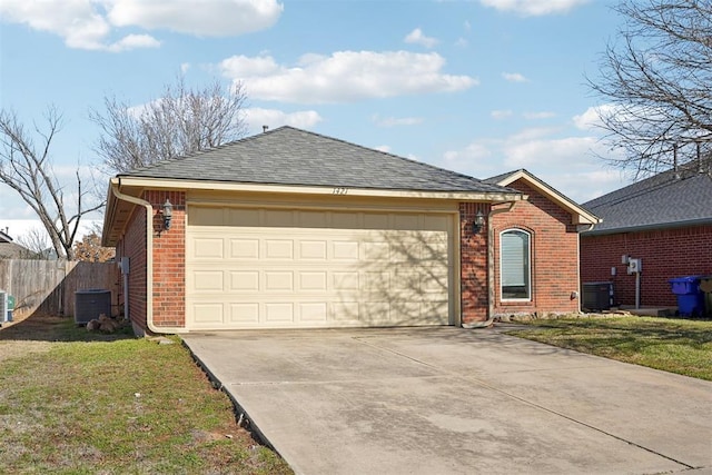 single story home with a garage, concrete driveway, brick siding, and fence