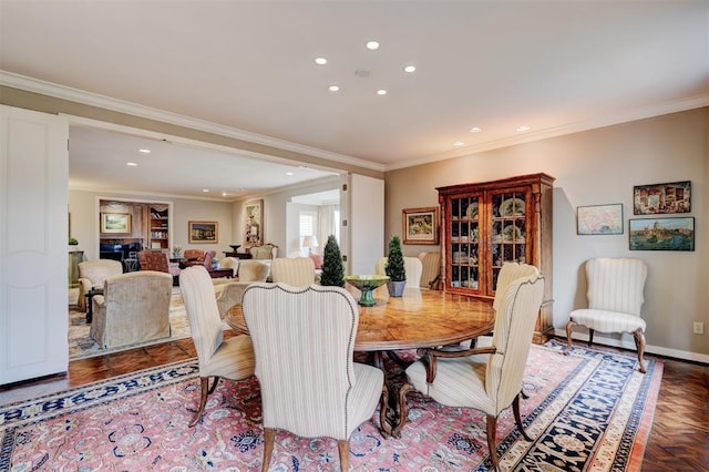 dining room featuring recessed lighting, crown molding, and baseboards