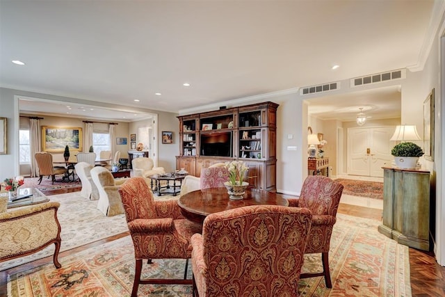 dining room with visible vents, crown molding, and recessed lighting