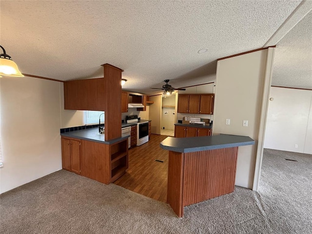 kitchen with range with electric cooktop, dark carpet, a textured ceiling, ceiling fan, and kitchen peninsula