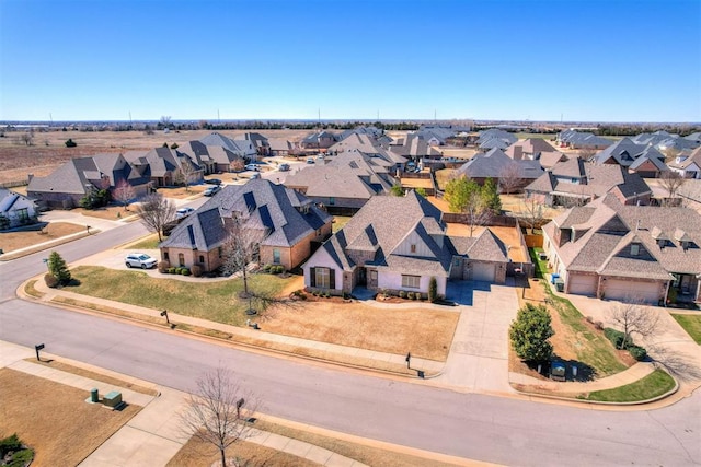 birds eye view of property with a residential view