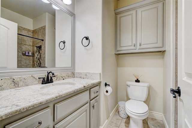 full bathroom with baseboards, vanity, toilet, and tile patterned floors