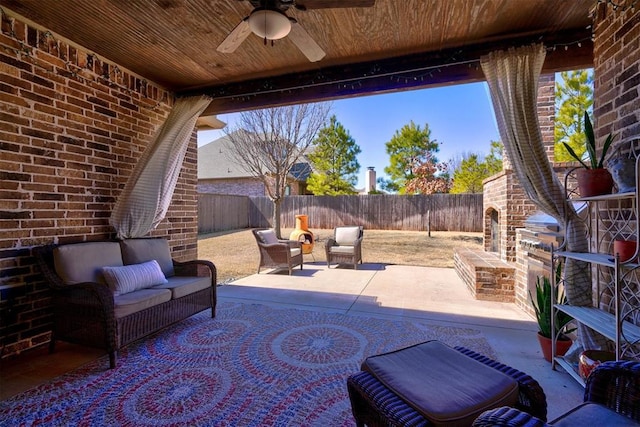 view of patio / terrace with ceiling fan, a fenced backyard, and an outdoor living space