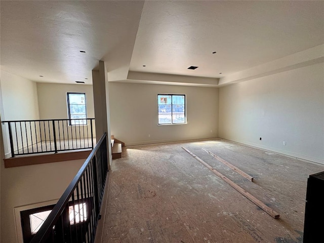 unfurnished room featuring baseboards