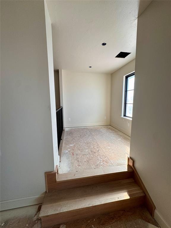 empty room with baseboards