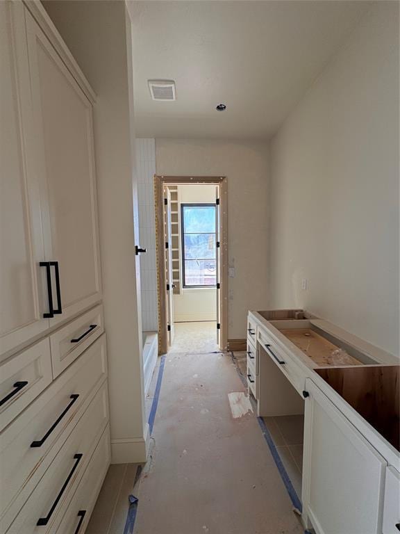 bathroom featuring walk in shower and visible vents