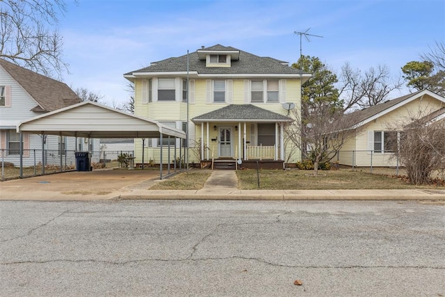 view of front property with covered porch and a carport