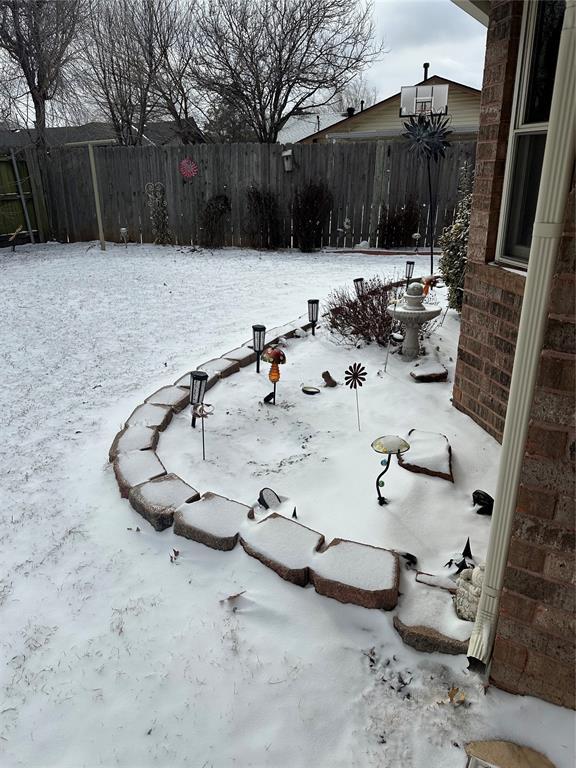 view of yard covered in snow