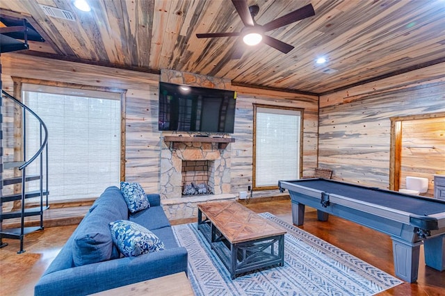 recreation room with pool table, wood walls, a fireplace, concrete floors, and wood ceiling