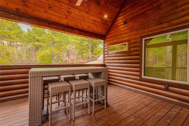 wooden terrace featuring outdoor dry bar