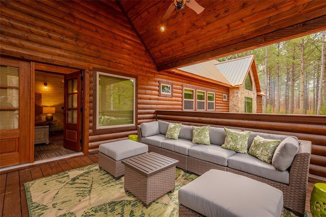 sunroom / solarium with lofted ceiling with skylight, a ceiling fan, and a healthy amount of sunlight