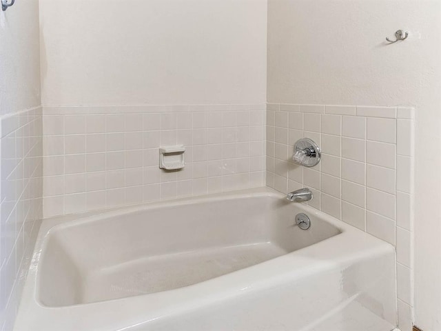 bathroom with a garden tub