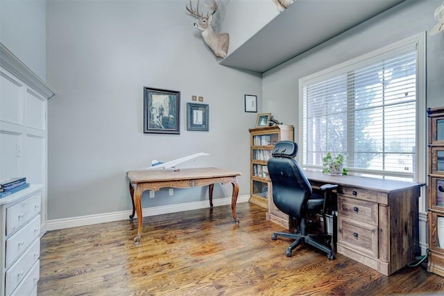 office area with baseboards and wood finished floors