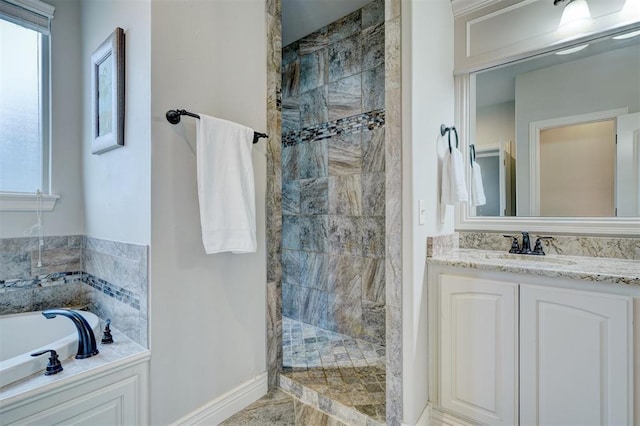 full bathroom with a garden tub, a tile shower, and vanity